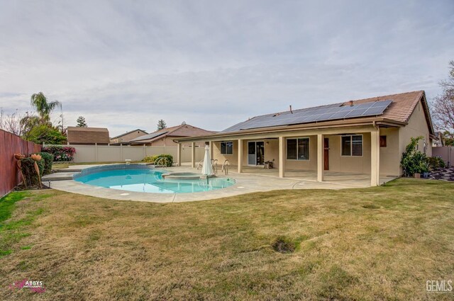 view of swimming pool featuring a lawn and a patio