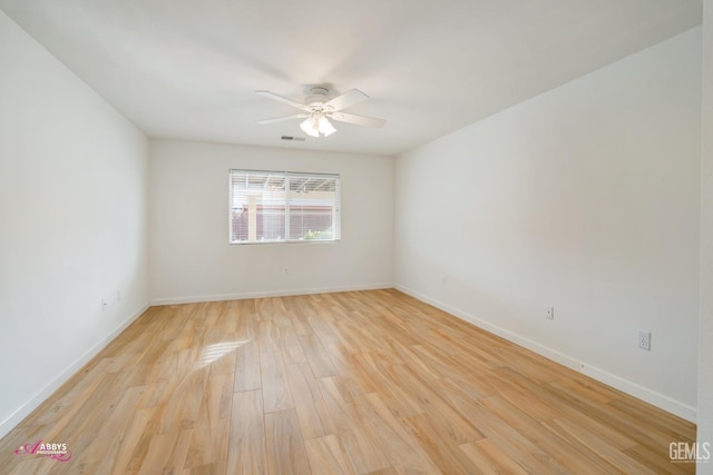 spare room featuring ceiling fan and light hardwood / wood-style flooring