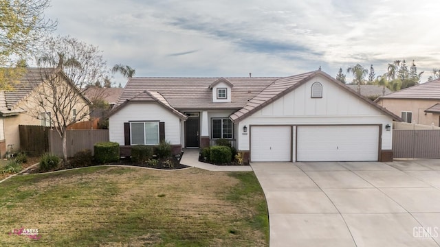 view of front facade with a garage and a front lawn