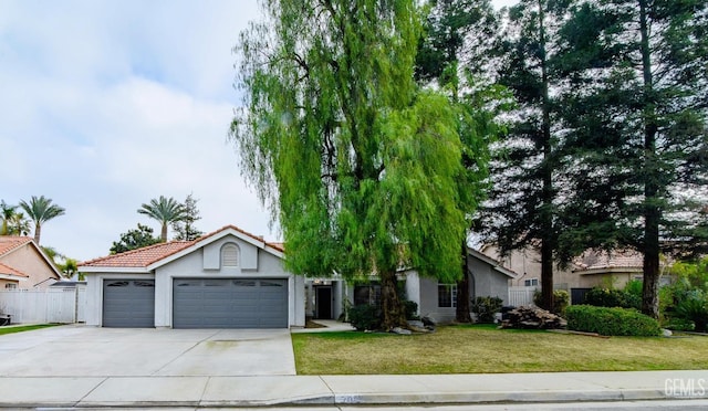 obstructed view of property featuring a front yard and a garage