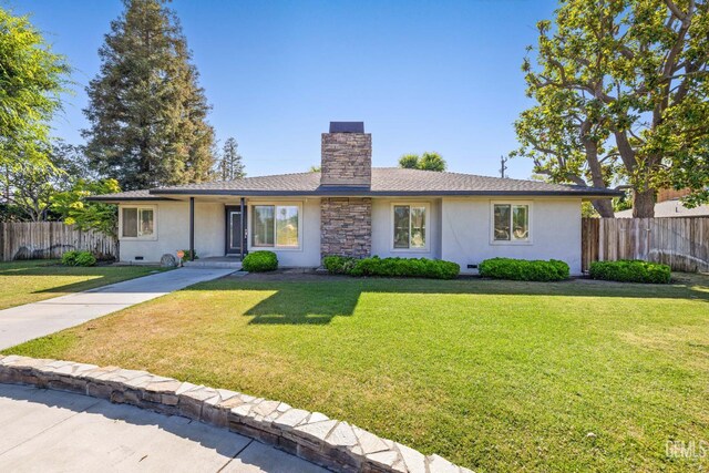 2330 Myrtle St, Bakersfield, CA 93301 - ranch-style house with stucco siding and a chimney