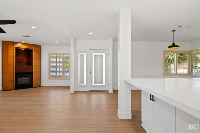 2330 Myrtle St, Bakersfield, CA 93301 - unfurnished living room featuring baseboards, light wood-style flooring, ceiling fan, and recessed lighting