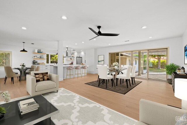 2330 Myrtle St, Bakersfield, CA 93301 - living room with light wood finished floors, plenty of natural light, ceiling fan, and recessed lighting