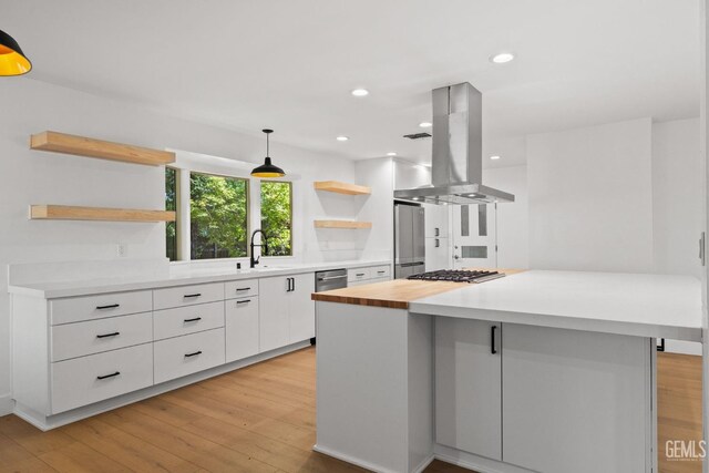 2330 Myrtle St, Bakersfield, CA 93301 - kitchen featuring open shelves, island range hood, white cabinetry, modern cabinets, and a center island