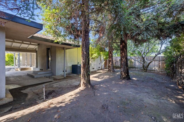 2330 Myrtle St, Bakersfield, CA 93301 - view of yard featuring cooling unit, fence, and a patio area