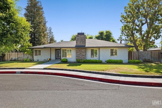 2330 Myrtle St, Bakersfield, CA 93301 - ranch-style house with stucco siding and a chimney