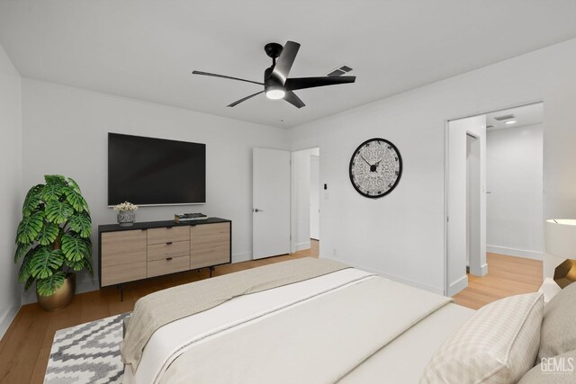 2330 Myrtle St, Bakersfield, CA 93301 - bedroom with light wood-style flooring, a ceiling fan, and baseboards