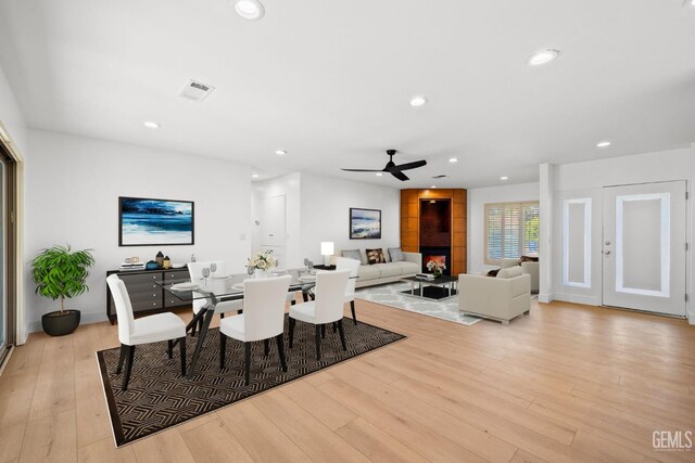 2330 Myrtle St, Bakersfield, CA 93301 - dining space featuring light wood finished floors, recessed lighting, ceiling fan, and a fireplace