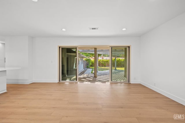 2330 Myrtle St, Bakersfield, CA 93301 - empty room with light wood-type flooring, baseboards, and recessed lighting