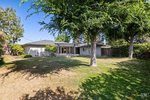 2330 Myrtle St, Bakersfield, CA 93301 - rear view of house with a pergola