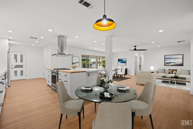 2330 Myrtle St, Bakersfield, CA 93301 - dining area featuring light wood-style flooring, a ceiling fan, and recessed lighting