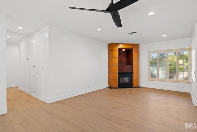 2330 Myrtle St, Bakersfield, CA 93301 - unfurnished living room with baseboards, light wood-type flooring, recessed lighting, a ceiling fan, and a large fireplace