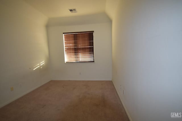 carpeted spare room with visible vents