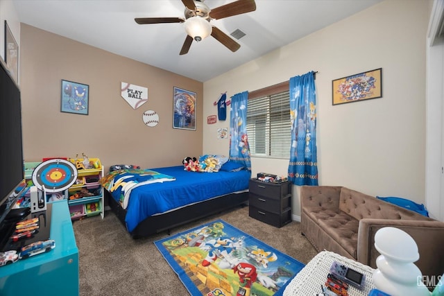 bedroom featuring ceiling fan, visible vents, and dark colored carpet