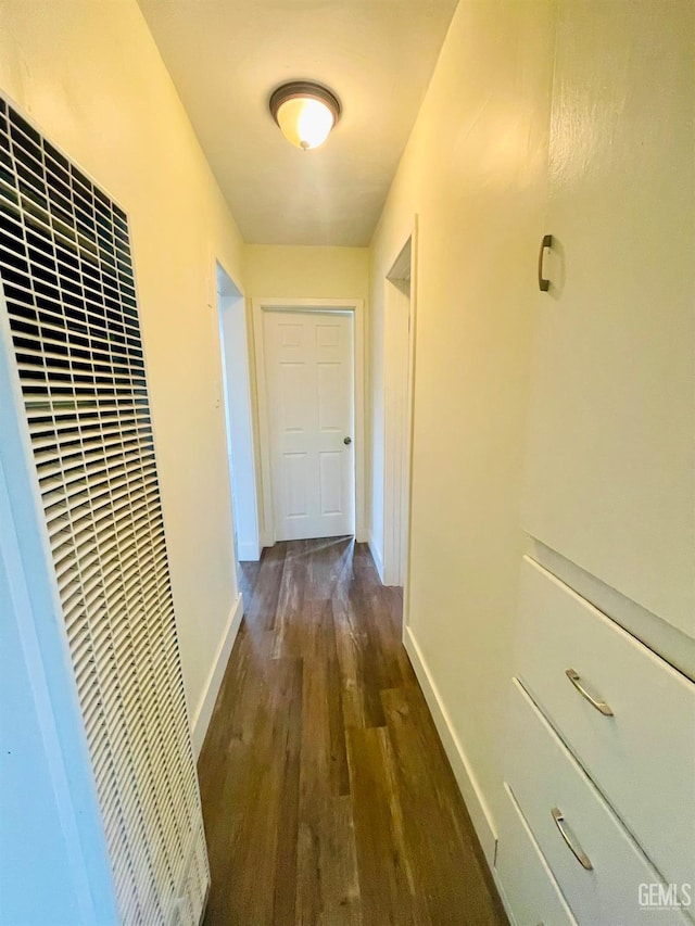 hall with dark hardwood / wood-style flooring