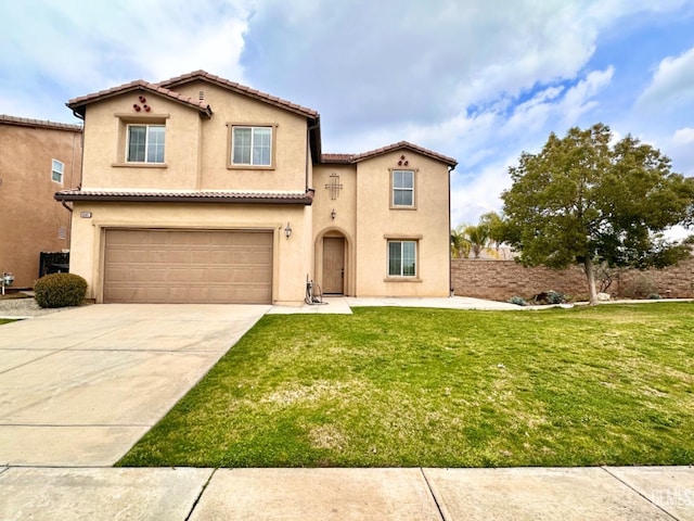 mediterranean / spanish-style home with a front lawn and a garage