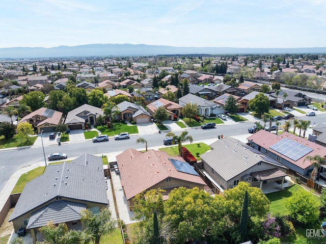 drone / aerial view featuring a mountain view and a residential view