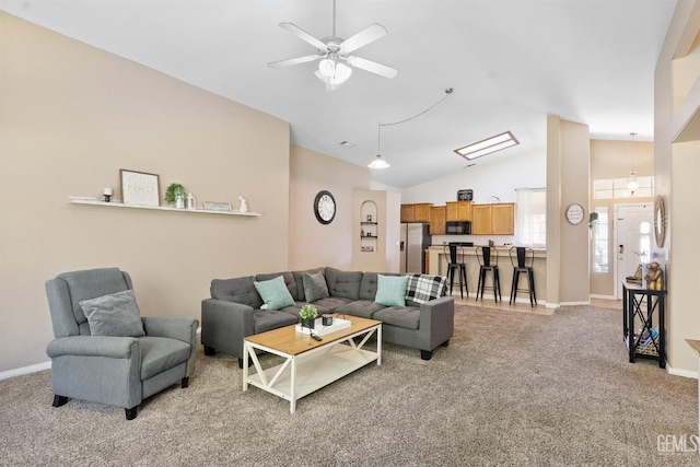 living area featuring baseboards, light carpet, lofted ceiling, and ceiling fan