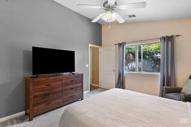 bedroom featuring lofted ceiling, baseboards, visible vents, and carpet floors