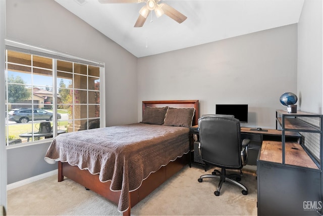 carpeted bedroom with baseboards, lofted ceiling, and ceiling fan