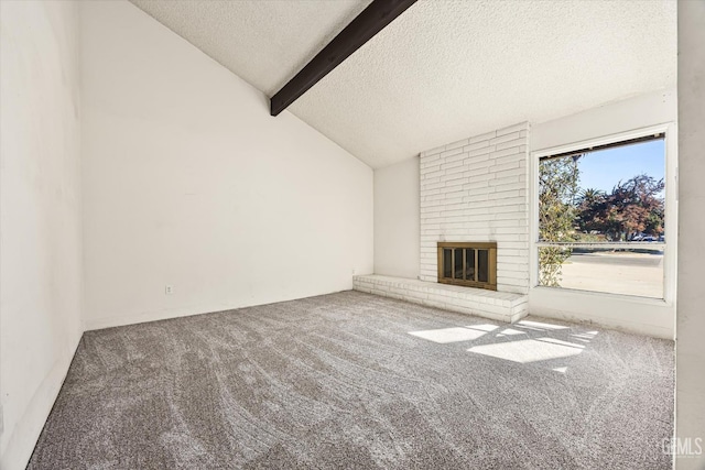 unfurnished living room featuring a textured ceiling, a brick fireplace, vaulted ceiling with beams, and carpet