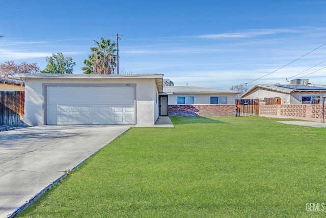 single story home featuring a front yard and a garage