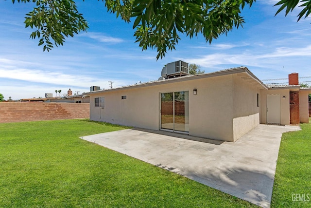 5117 Centaur St, Bakersfield, CA 93304 - rear view of property featuring stucco siding, central AC, and a patio area