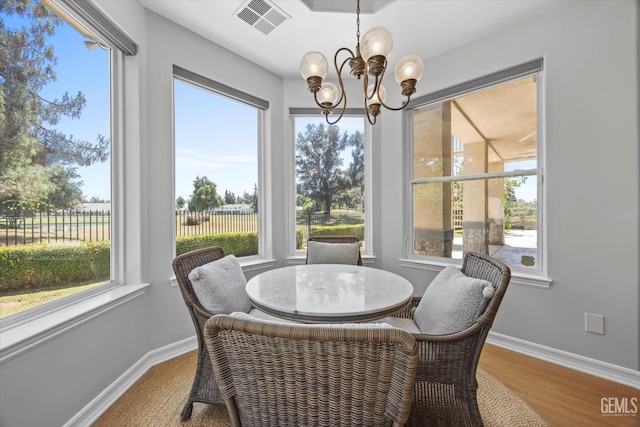 2120 Wedgemont Pl, Bakersfield, CA 93311 - dining room with a chandelier, wood finished floors, and plenty of natural light