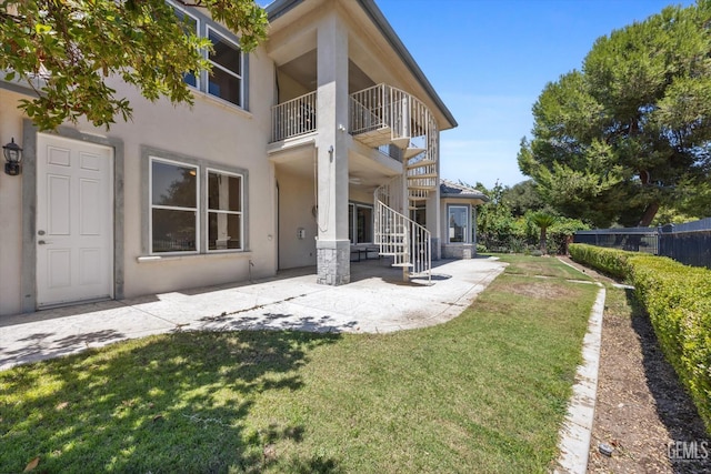 2120 Wedgemont Pl, Bakersfield, CA 93311 - rear view of house featuring stucco siding, a patio area, a balcony, and stairs