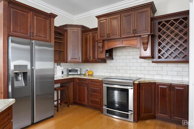 2120 Wedgemont Pl, Bakersfield, CA 93311 - kitchen featuring appliances with stainless steel finishes, light wood-style floors, tasteful backsplash, light stone countertops, and ornamental molding