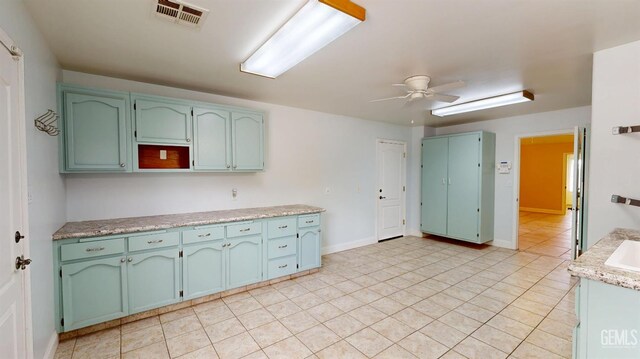 1334 Renfro Rd, Bakersfield, CA 93314 - kitchen with ceiling fan, light countertops, and light tile patterned flooring