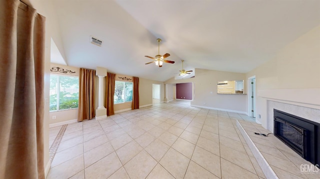 1334 Renfro Rd, Bakersfield, CA 93314 - unfurnished living room with a fireplace, vaulted ceiling, light tile patterned floors, a ceiling fan, and baseboards