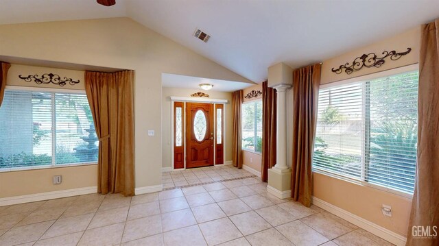 1334 Renfro Rd, Bakersfield, CA 93314 - entrance foyer featuring vaulted ceiling, decorative columns, light tile patterned flooring, and baseboards