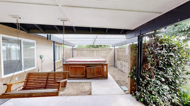 1334 Renfro Rd, Bakersfield, CA 93314 - view of patio with a hot tub and a fenced backyard