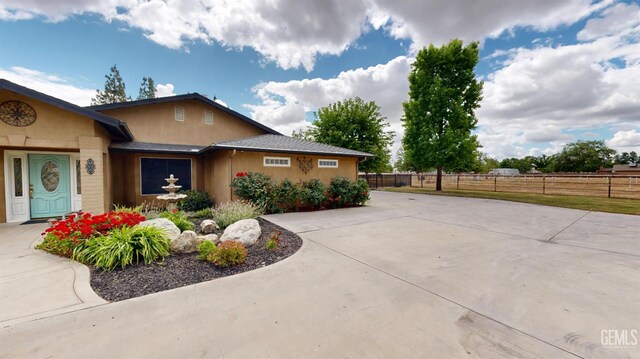 1334 Renfro Rd, Bakersfield, CA 93314 - view of home's exterior featuring fence and stucco siding