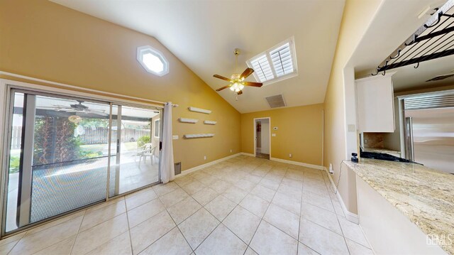 1334 Renfro Rd, Bakersfield, CA 93314 - unfurnished living room featuring ceiling fan, high vaulted ceiling, light tile patterned flooring, and baseboards