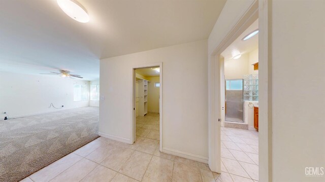 1334 Renfro Rd, Bakersfield, CA 93314 - hall with light tile patterned flooring, light colored carpet, and baseboards