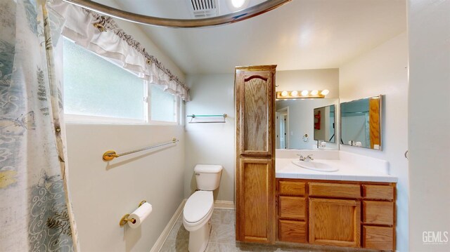 1334 Renfro Rd, Bakersfield, CA 93314 - full bath with toilet, tile patterned floors, vanity, and baseboards