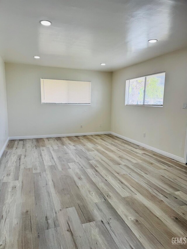 123 Ferguson Ave, Bakersfield, CA 93308 - spare room featuring light wood-style flooring, baseboards, and recessed lighting