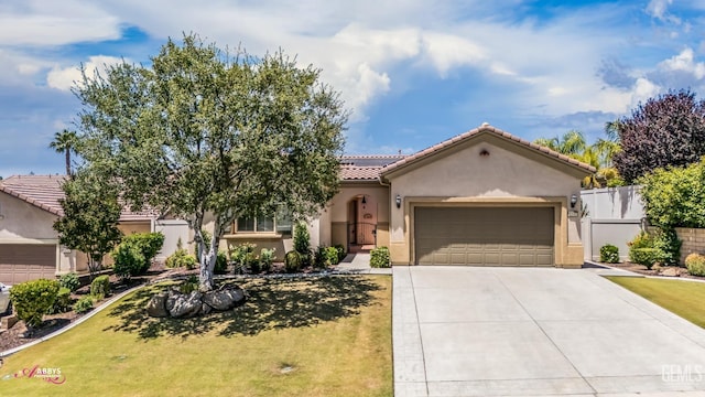 6100 Lassen Ridge Rd, Bakersfield, CA 93306 - mediterranean / spanish home featuring an attached garage, driveway, a tile roof, and stucco siding