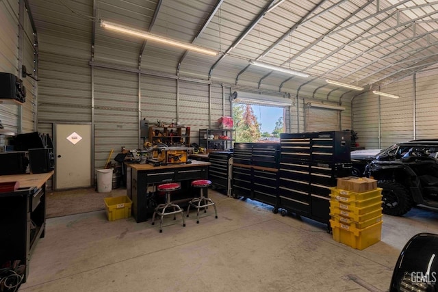 854 Vineland Rd, Bakersfield, CA 93306 - garage with a workshop area and metal wall