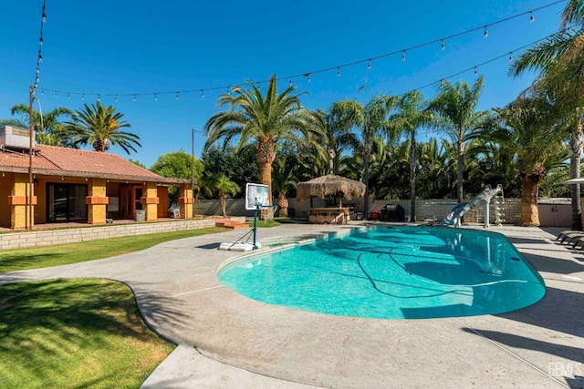 854 Vineland Rd, Bakersfield, CA 93306 - view of pool with a water slide, a patio area, and a fenced backyard