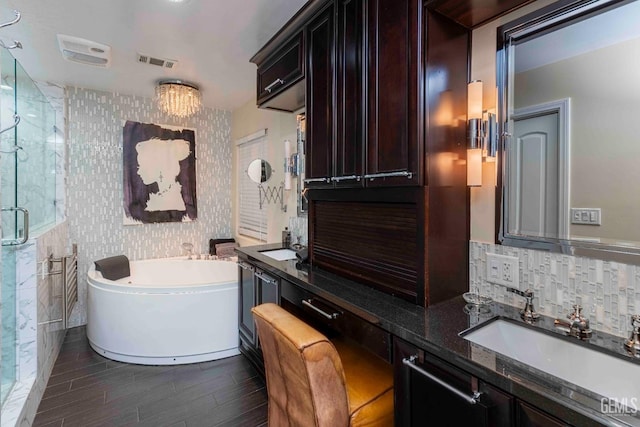 854 Vineland Rd, Bakersfield, CA 93306 - full bath featuring a bath, a stall shower, wood finished floors, wallpapered walls, and vanity