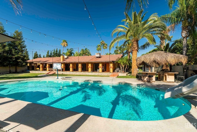 854 Vineland Rd, Bakersfield, CA 93306 - swimming pool with a water slide and a patio area