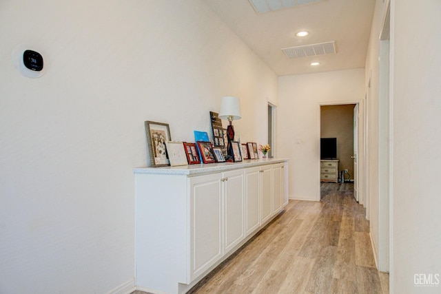 hall with light hardwood / wood-style flooring