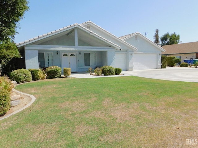 single story home featuring a front yard and a garage