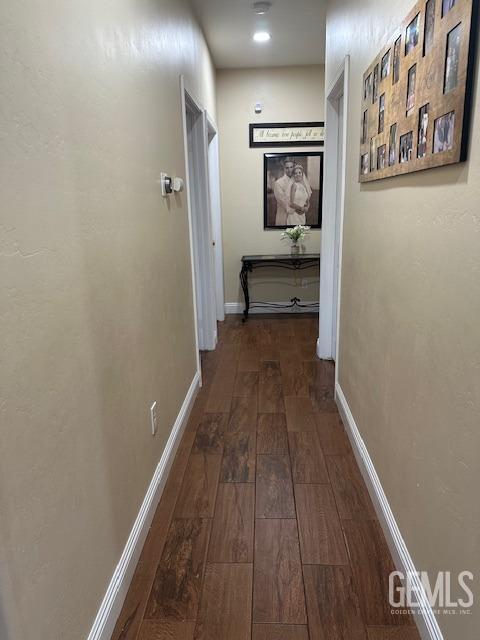 hall with dark hardwood / wood-style floors