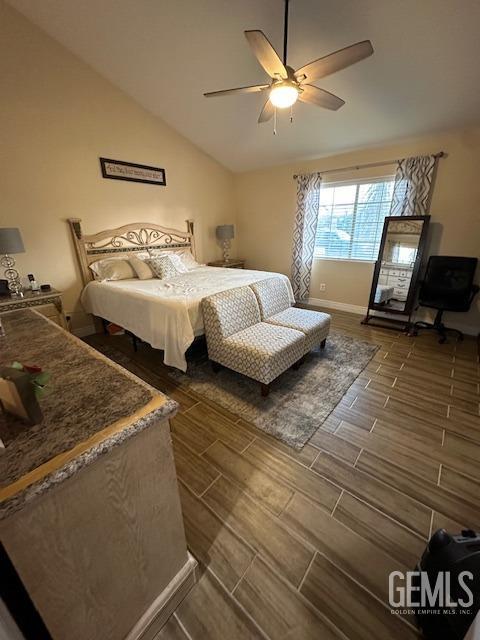 bedroom featuring lofted ceiling and ceiling fan