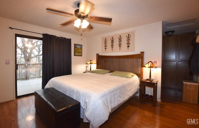 bedroom featuring access to exterior, multiple windows, hardwood / wood-style flooring, and ceiling fan