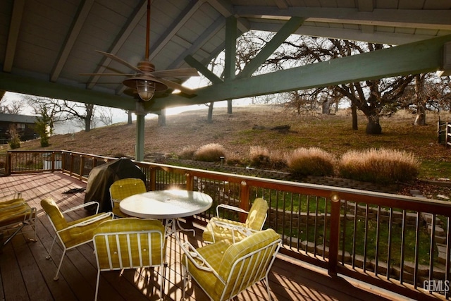 wooden terrace featuring ceiling fan